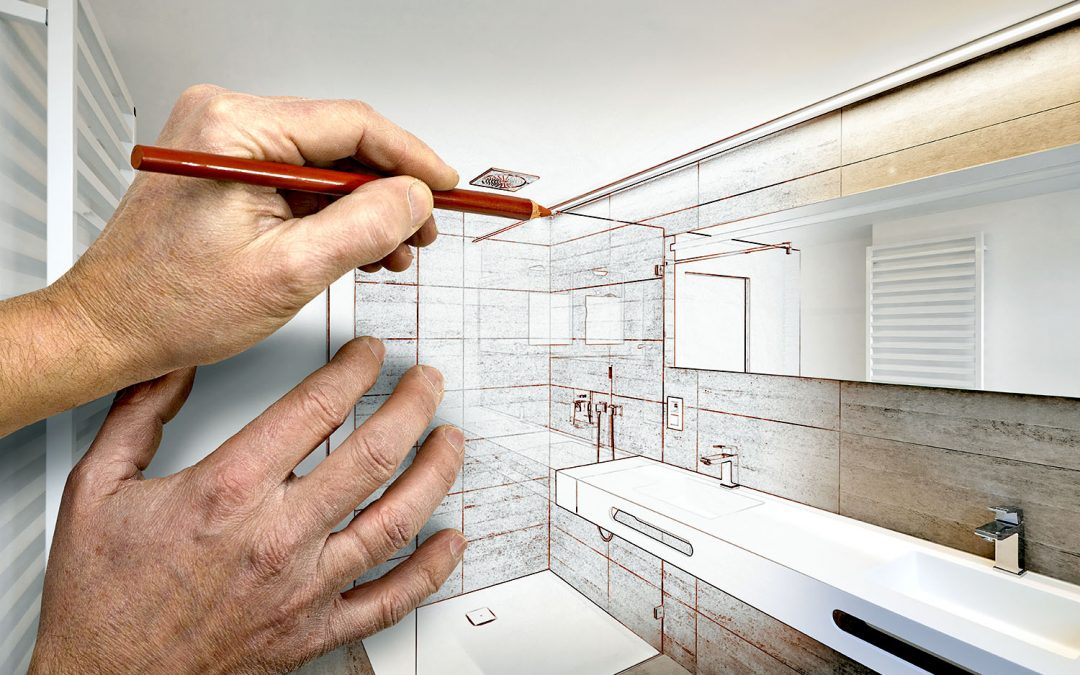 Hands creating a layout of their dream basement bathroom